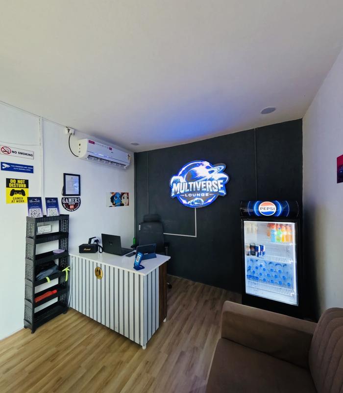 Multiverse Lounge reception with neon logo and drinks