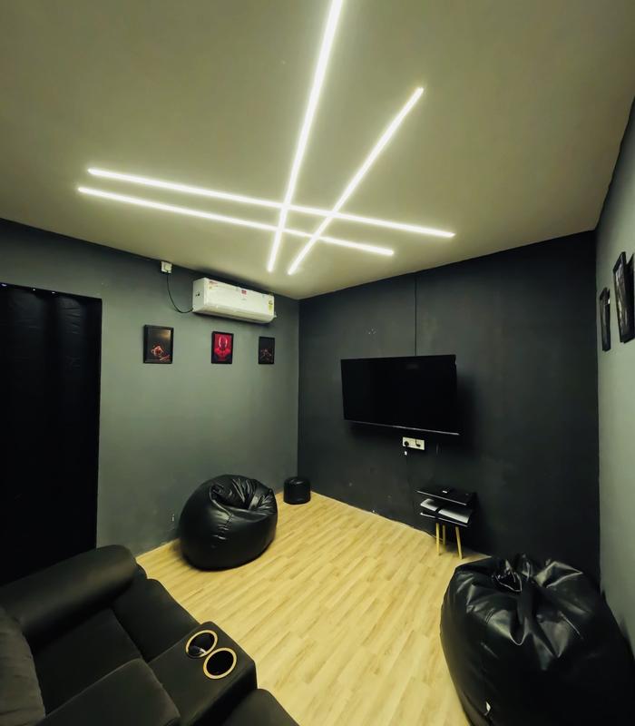 Second private gaming room with Spider-Man art